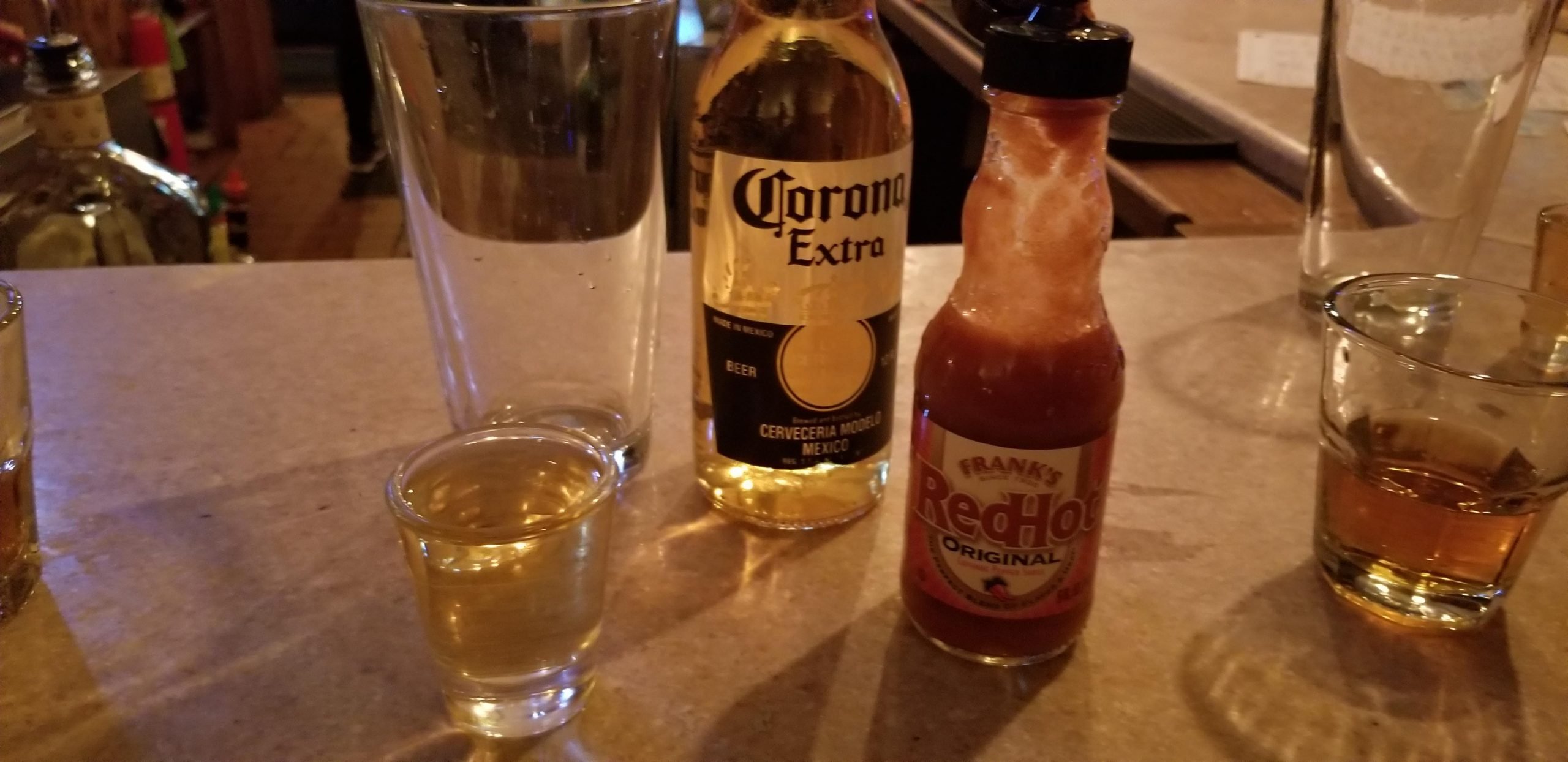 1 shot of tequila with a dash of hot sauce bombed into a ...